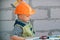 Portrait of little builder in hardhats with instruments for renovation on construction. Builder boy, carpenter kid with