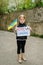 Portrait little child calls no war, raises banner with inscription Stop war in Ukraine and blue-yellow flag of Ukraine. Peace,