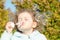 Portrait little cute girl blows soap bubbles