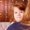 Portrait little cute girl. Small child, mom hands. Brown background with bokeh