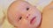 portrait of a little cute newborn baby with a curious look.extremely close-up