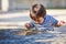 Portrait of a little eastern handsome baby boy playing outdoor in the park