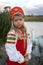 Portrait of Little girl dressed in Russian national costume on natural background