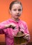 Portrait of little girl and a grinder