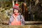 Portrait of little girl on hiking forest trip and watermill