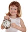 Portrait of little girl holding alarm clock