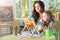 Portrait of little girl with mother using abacus