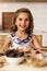 Portrait of little girl preparing baking cookies.