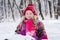 Portrait of a little girl in a snowdrift.