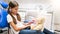 Portrait of little girl with teddy bear playing in dentist office in clinic