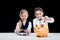 Portrait of little girls sitting at table and calculating money