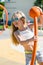 Portrait of little happy girl at playground