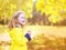 Portrait little positive child having fun outdoors in autumn