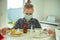 Portrait of little sick child in mask with lemon and at quarantine becouse of coronavirus