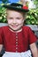 Portrait of a little smiling Bavarian girl with hat