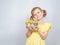 Portrait of little smiling girl with a shopping basket filled with Easter things