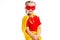 Portrait of little supergirl wearing yellow cape and red mask for eyes
