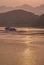 Portrait of loaded barge while sunset reflected by Yangtze River, Chongqing, China