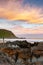 A portrait long exposure sunset over the  beach at Petrel Cove located on the Fleurieu Peninsula Victor Harbor South Australia on