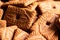 A portrait of a lot of brown cookies called speculoos or speculaas in Belgium or the Netherlangs. The spiced biscuit is very