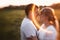 Portrait of love story man and woman on the background haystack