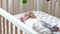 Portrait of lovely baby lying on crib