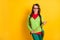 Portrait of lovely funky cheerful smart girl holding in hands pointer teaching isolated over vibrant yellow color