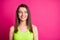 Portrait of lovely positive brunette long straight hair girl wear lime top isolated on vivid pink background
