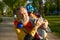 Portrait of loving grandparent and grandson hugging after roller skating