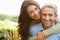 Portrait Of Loving Hispanic Couple In Countryside