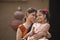 Portrait of loving Indian mother and daughter at village