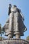 Portrait Low Angle Zoom View Buddha Pacifying Relatives Statue on Blue Sky Background