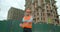 Portrait of male builders engineers contractor worker foreman architect in hard hat on background of building under