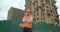 Portrait of male builders engineers contractor worker foreman architect in hard hat on background of building under