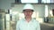 Portrait of a male engineer in helmet . Portrait of Businessman in Industrial Warehouse. slow-motion. airduct of an HVAC