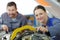 portrait male and female aircraft mechanics at work