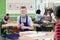 Portrait Of Male High School Student Building Guitar In Woodwork