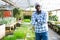 Portrait of male hired worker in greenhouse where flowers are grown