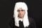 Portrait Of Male Judge in a wig on black