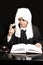 Portrait Of Male Lawyer With Judge Gavel And Book on black background