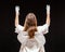 Portrait of male mime artist, isolated on black background. Back view of a man dressed like an angel standing with his