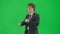 Portrait of male model in suit isolated on chroma key green screen background. Close up shot young businessman in suit