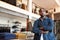 Portrait Of Male Owner Of Fashion Store Standing In Front Of Clothing Display