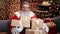 Portrait male Santa Claus posing with heap of wrapped gift boxes. Shot on RED Raven 4k Cinema Camera