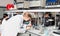 Portrait of male scientist registering results of research in notebook at biochemical laboratory