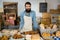 Portrait of male staff standing at bakery counter