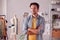 Portrait Of Male Student Or Business Owner Working In Fashion Standing By Desk