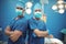 Portrait of male surgeons standing in operation theater