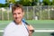 Portrait of male tennis player after playing