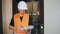 Portrait of a male utility worker, elevator repairman. A utility worker during an elevator repair. Engineer with